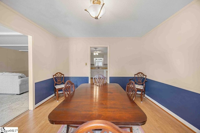 dining area with wood finished floors and baseboards