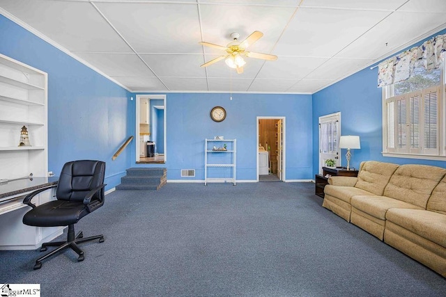 carpeted office space with ceiling fan, crown molding, washer / clothes dryer, and baseboards