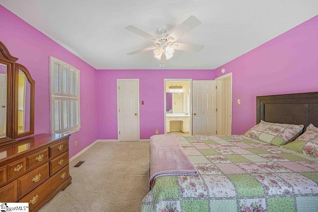 bedroom featuring visible vents, a ceiling fan, carpet flooring, connected bathroom, and baseboards