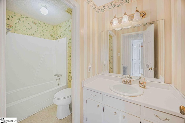 full bath with shower / washtub combination, toilet, a textured ceiling, vanity, and wallpapered walls