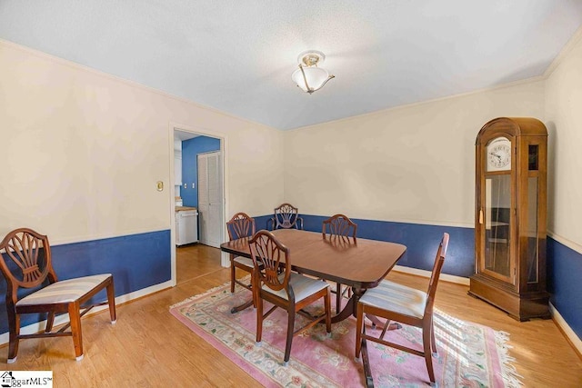 dining area with wood finished floors and baseboards