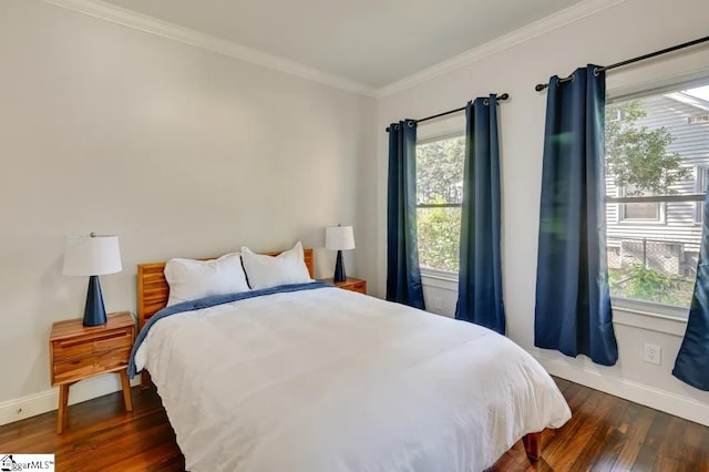 bedroom featuring multiple windows, dark wood-type flooring, and crown molding