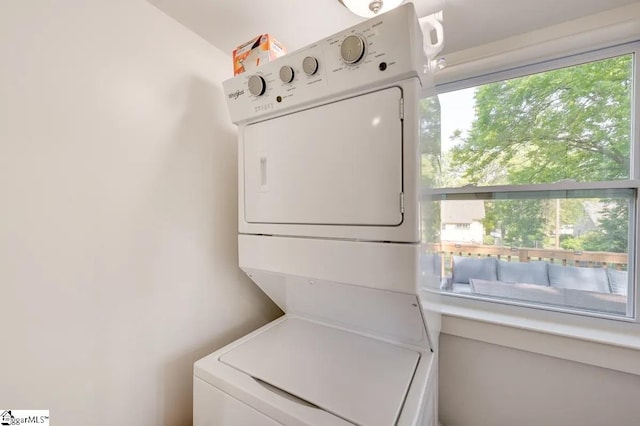 laundry room with laundry area and stacked washer and clothes dryer