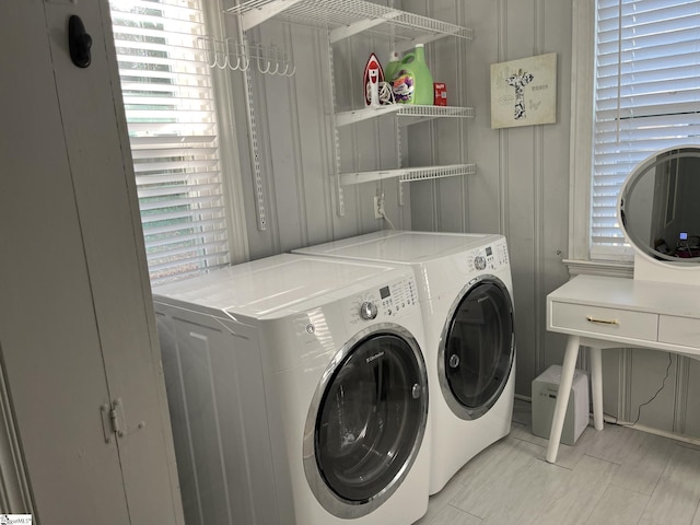 laundry room with washer and dryer and laundry area