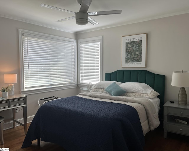 bedroom with crown molding, baseboards, ceiling fan, and dark wood-type flooring