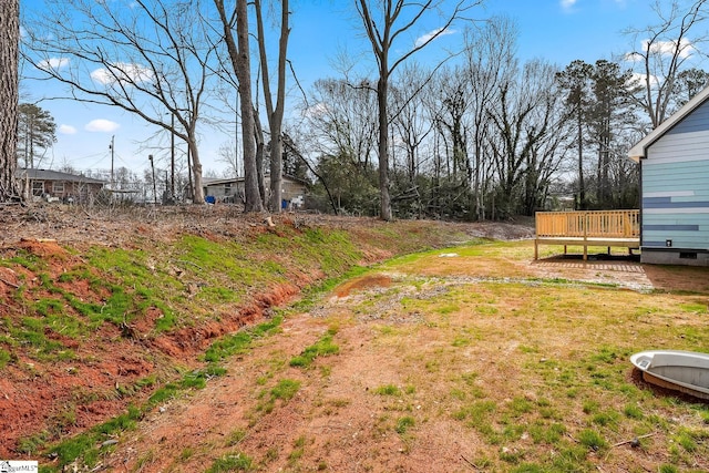 view of yard featuring a wooden deck