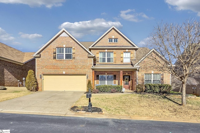 traditional-style house with driveway, a garage, a front lawn, and brick siding