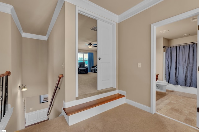 hall with crown molding, visible vents, light carpet, an upstairs landing, and baseboards