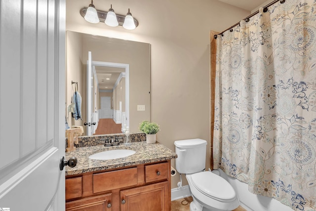 full bathroom featuring toilet, vanity, and shower / bathtub combination with curtain