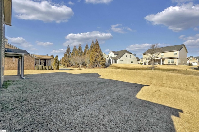 view of yard featuring a residential view