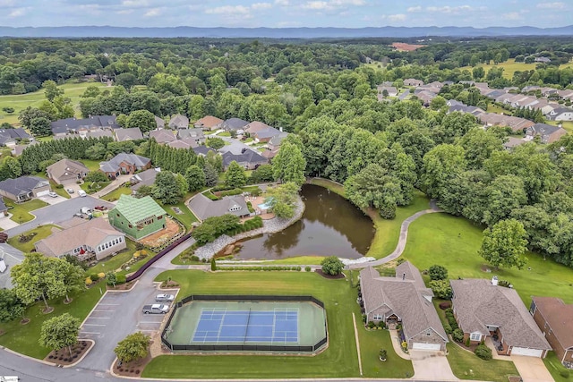 drone / aerial view featuring a residential view and a water view