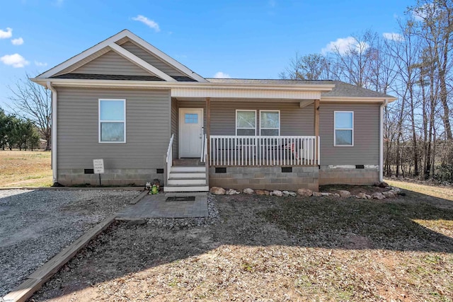 view of front of property with a porch, crawl space, and roof with shingles