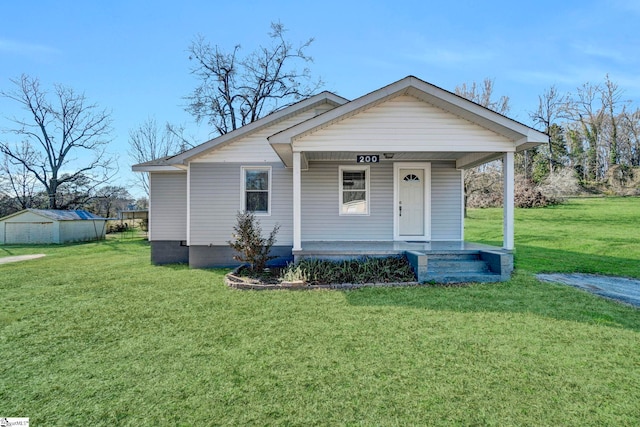 view of front of house with a porch and a front lawn