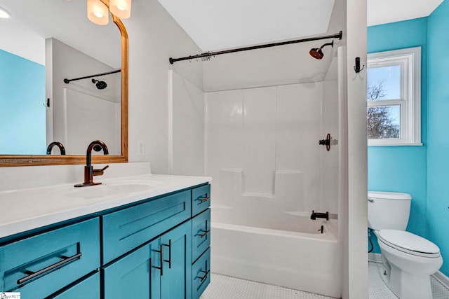 bathroom with toilet, bathing tub / shower combination, tile patterned flooring, and vanity