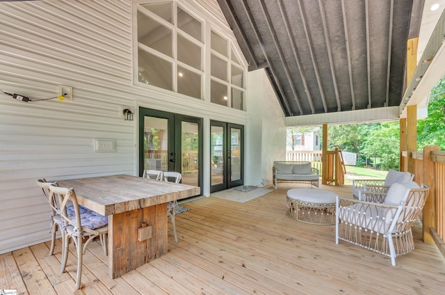 deck with french doors and exterior bar