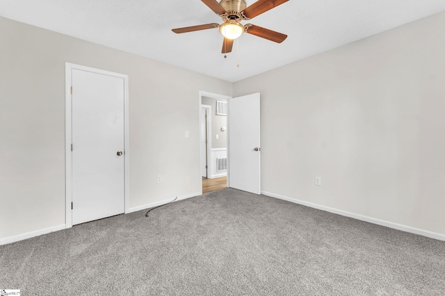 unfurnished bedroom featuring visible vents, carpet floors, a ceiling fan, and baseboards