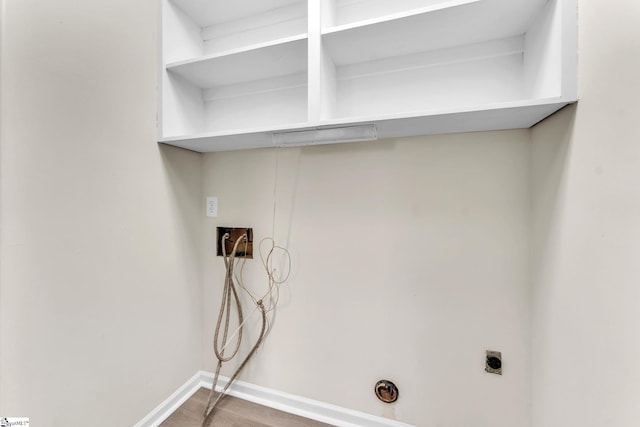 laundry room with laundry area, baseboards, wood finished floors, washer hookup, and electric dryer hookup