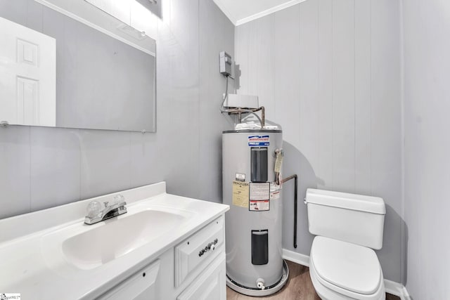 half bath featuring toilet, wood finished floors, vanity, and electric water heater