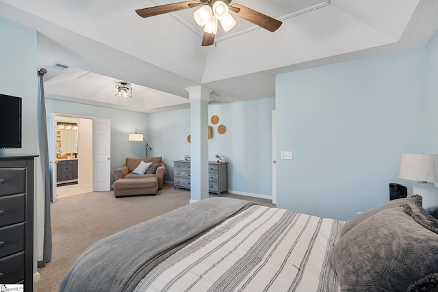 bedroom with a raised ceiling, light colored carpet, connected bathroom, and visible vents