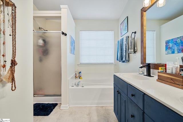 full bath featuring double vanity, a garden tub, a shower stall, and a sink