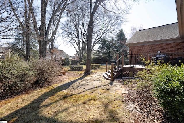 view of yard with a wooden deck