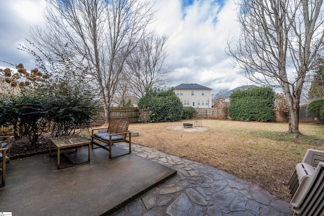 view of patio with an outdoor fire pit and a fenced backyard