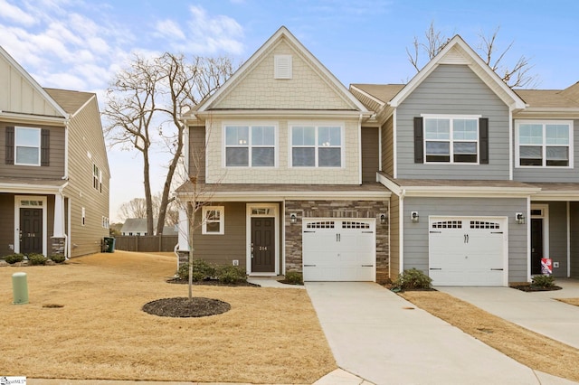 view of front of home with stone siding and driveway