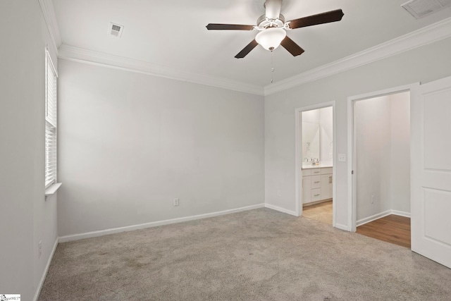 unfurnished bedroom featuring ornamental molding, light colored carpet, visible vents, and multiple windows