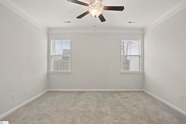 unfurnished room with visible vents, crown molding, light carpet, and baseboards