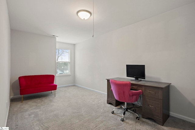 home office with light colored carpet, visible vents, and baseboards