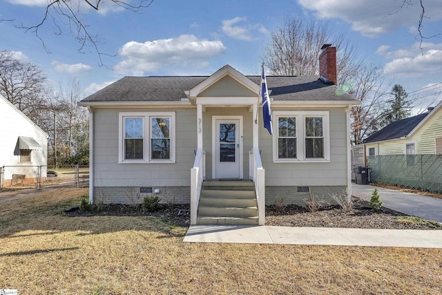 bungalow featuring crawl space, fence, and a chimney