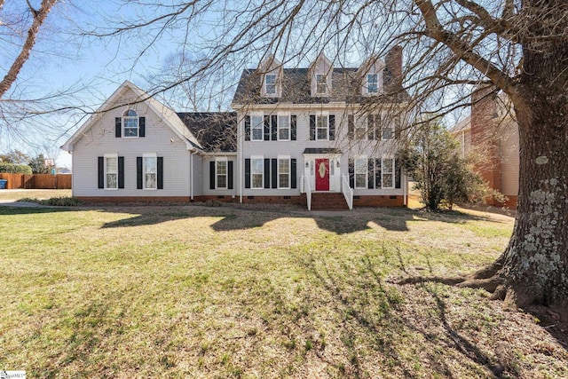 view of front of property featuring a chimney, crawl space, and a front yard