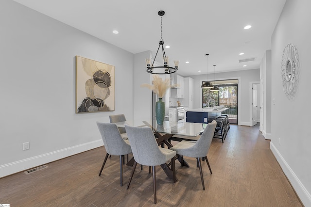 dining area featuring recessed lighting, baseboards, and wood finished floors