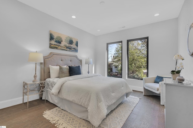 bedroom featuring recessed lighting, dark wood-style flooring, and baseboards