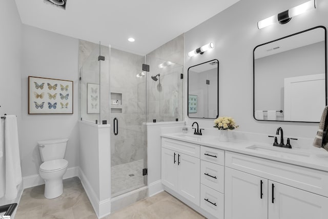 bathroom featuring double vanity, visible vents, toilet, a sink, and a shower stall