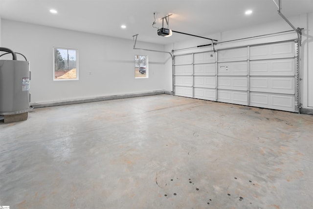 garage with water heater and a garage door opener