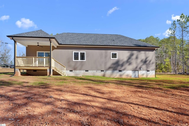 rear view of house featuring a shingled roof, a ceiling fan, stairs, a yard, and crawl space