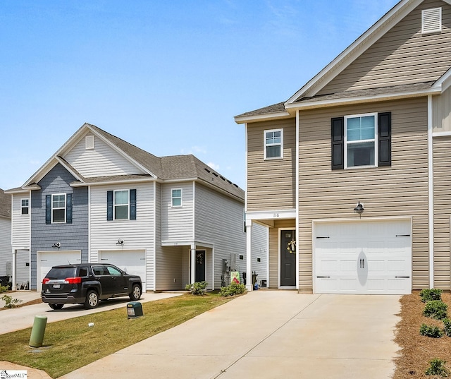 view of front of property featuring driveway and an attached garage