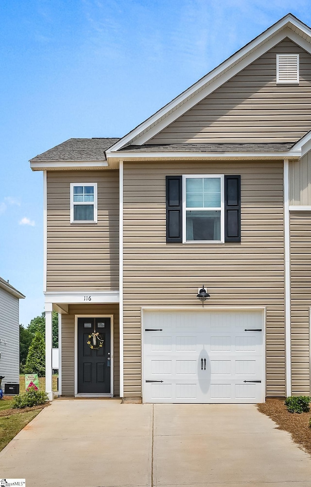 view of front of home featuring a garage and concrete driveway