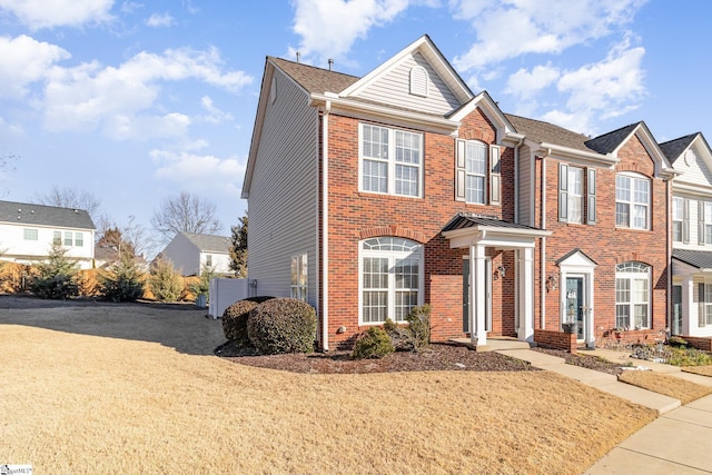 view of property with brick siding