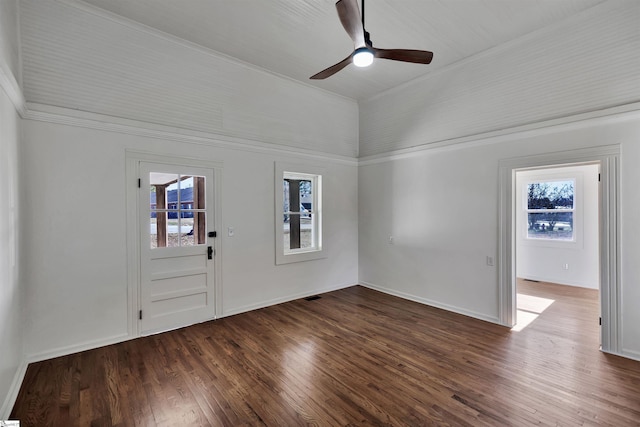 foyer with visible vents, a ceiling fan, vaulted ceiling, baseboards, and dark wood finished floors