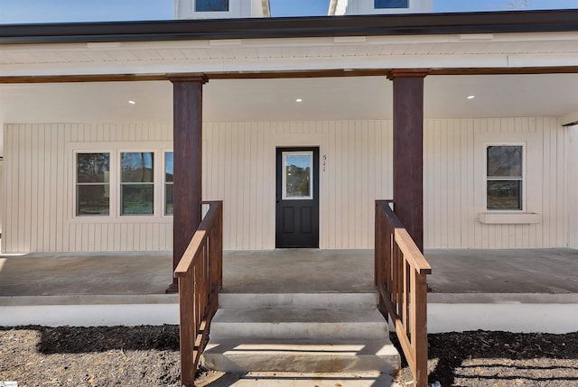 doorway to property with covered porch