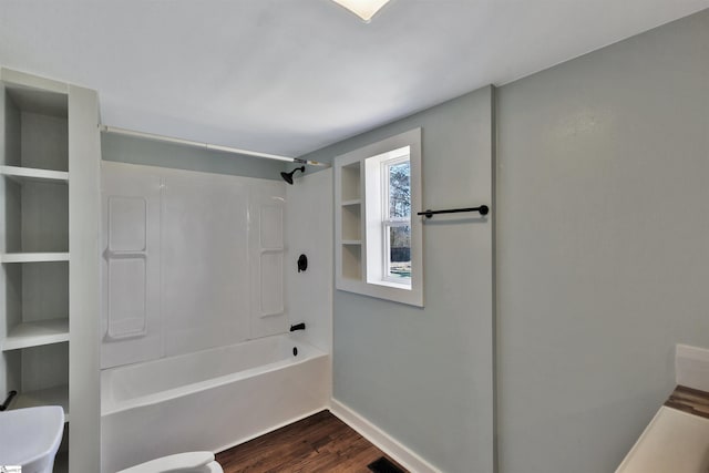 full bathroom featuring shower / bath combination, visible vents, toilet, wood finished floors, and baseboards