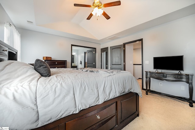 bedroom featuring lofted ceiling, ceiling fan, visible vents, and light colored carpet