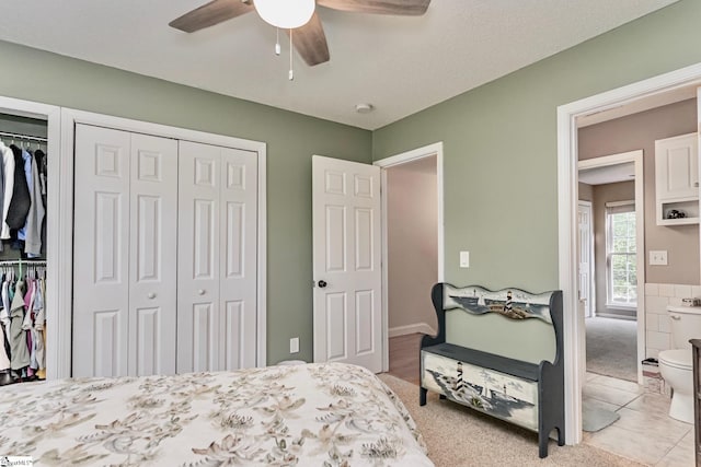 bedroom featuring ceiling fan and light tile patterned flooring