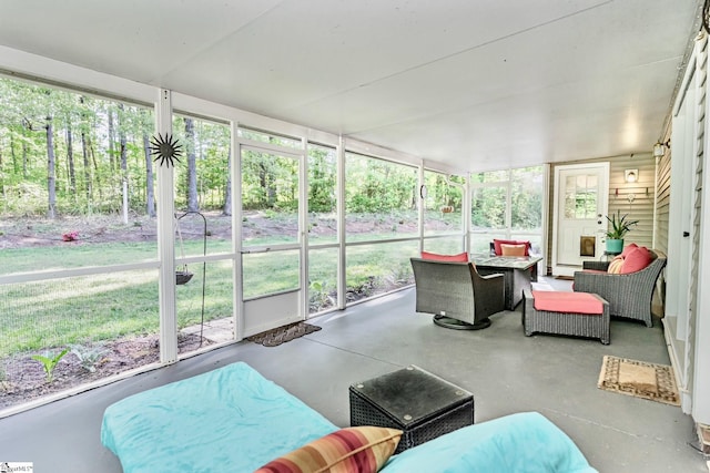 sunroom / solarium featuring a healthy amount of sunlight