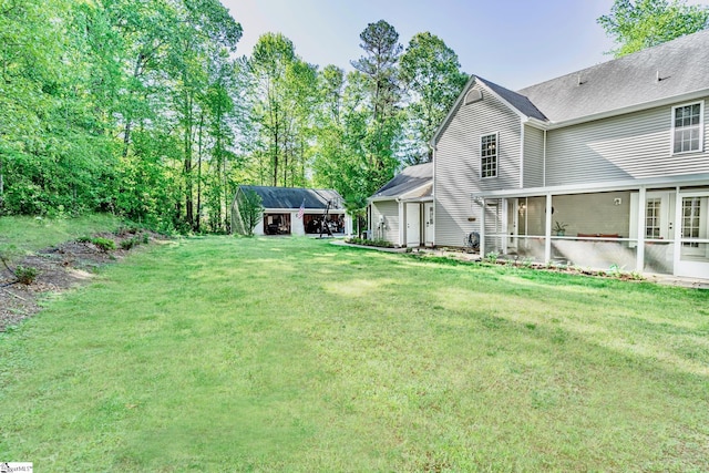 view of yard with a sunroom