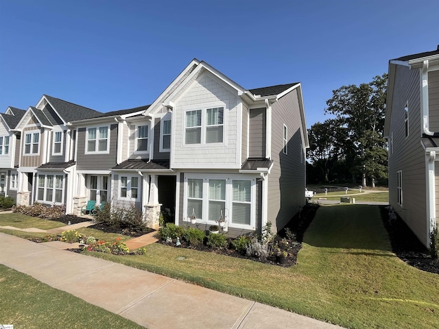 view of front of property featuring a front lawn and a residential view