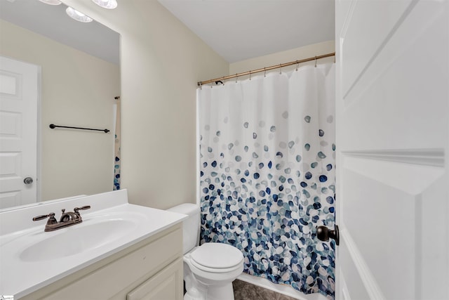 full bathroom featuring vanity and toilet