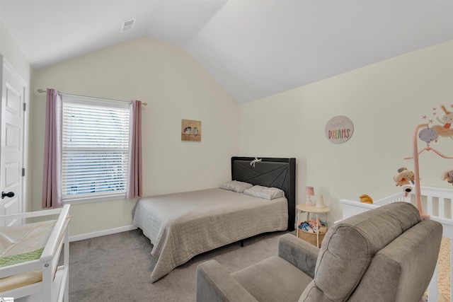 carpeted bedroom featuring vaulted ceiling, visible vents, and baseboards